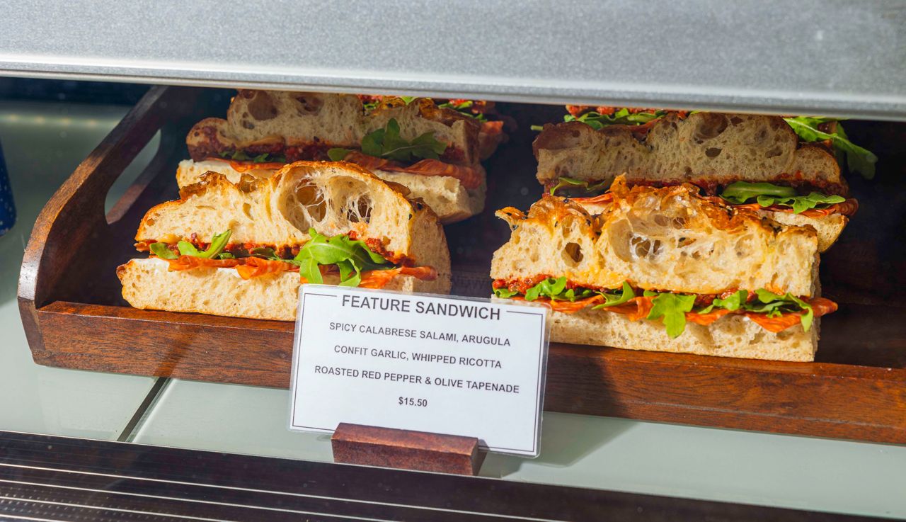 Focaccia sandwiches featuring salami, arugula and whipped ricotta