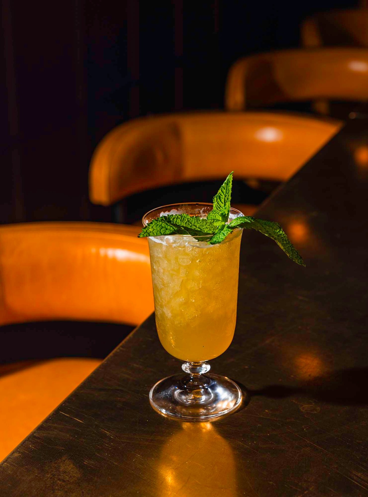 The Pineapple Pen is a cocktail made with pandan-infused rum, pineapple juice, pink peppercorn and mint