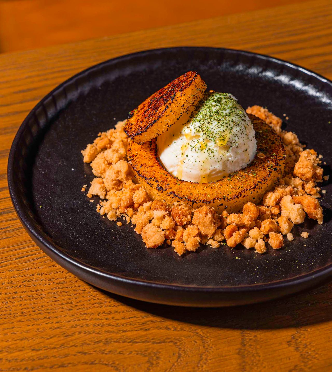 Olive cake with a scoop of gelato and vanilla crumble
